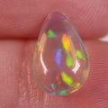 1.7ct bright blue-orange crystal opal cabochon with glitter pattern