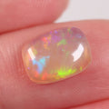 2ct lively red-green crystal opal cabochon with galaxy pattern