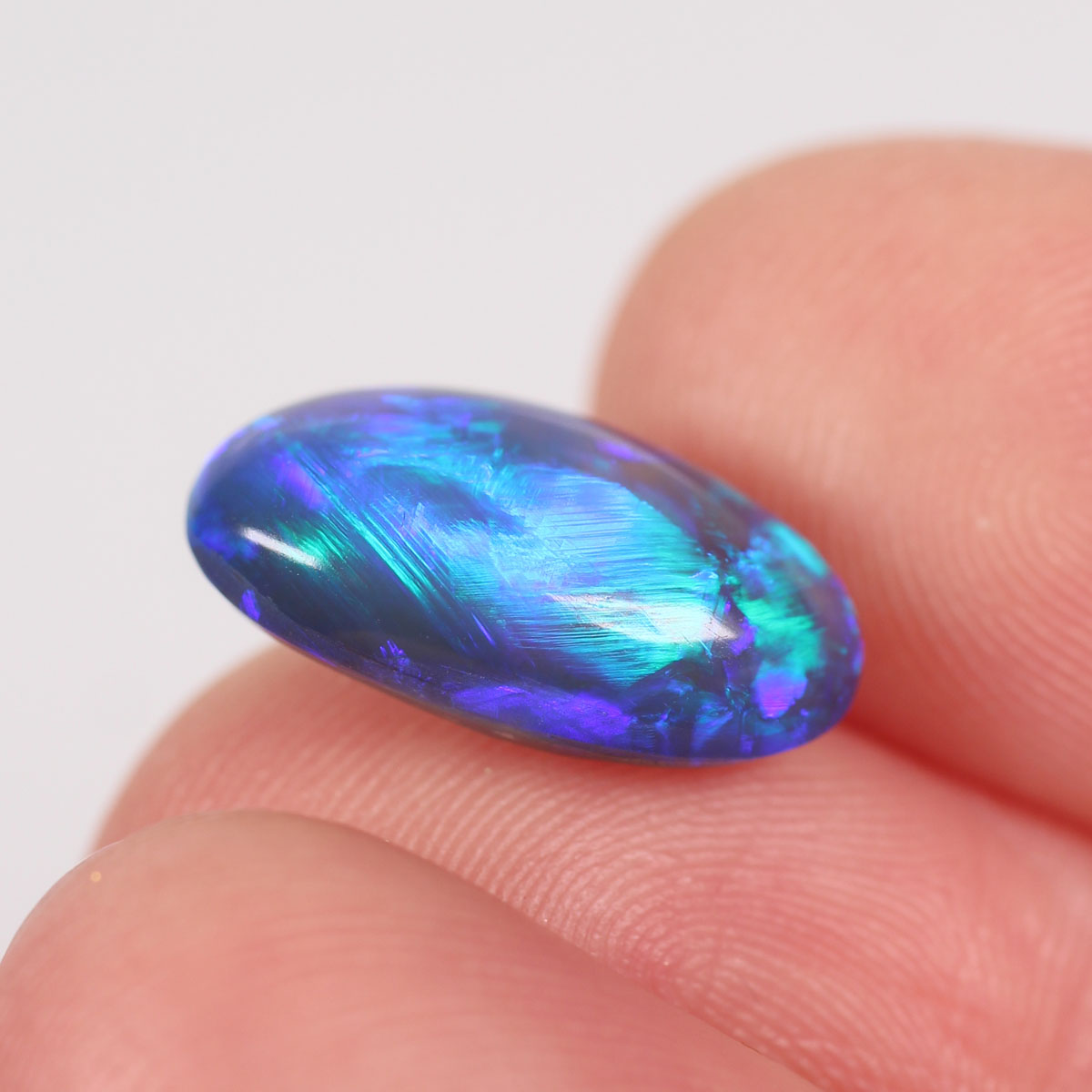 4.57ct Black Opal - 8.7 x 15.5 x 5.9mm