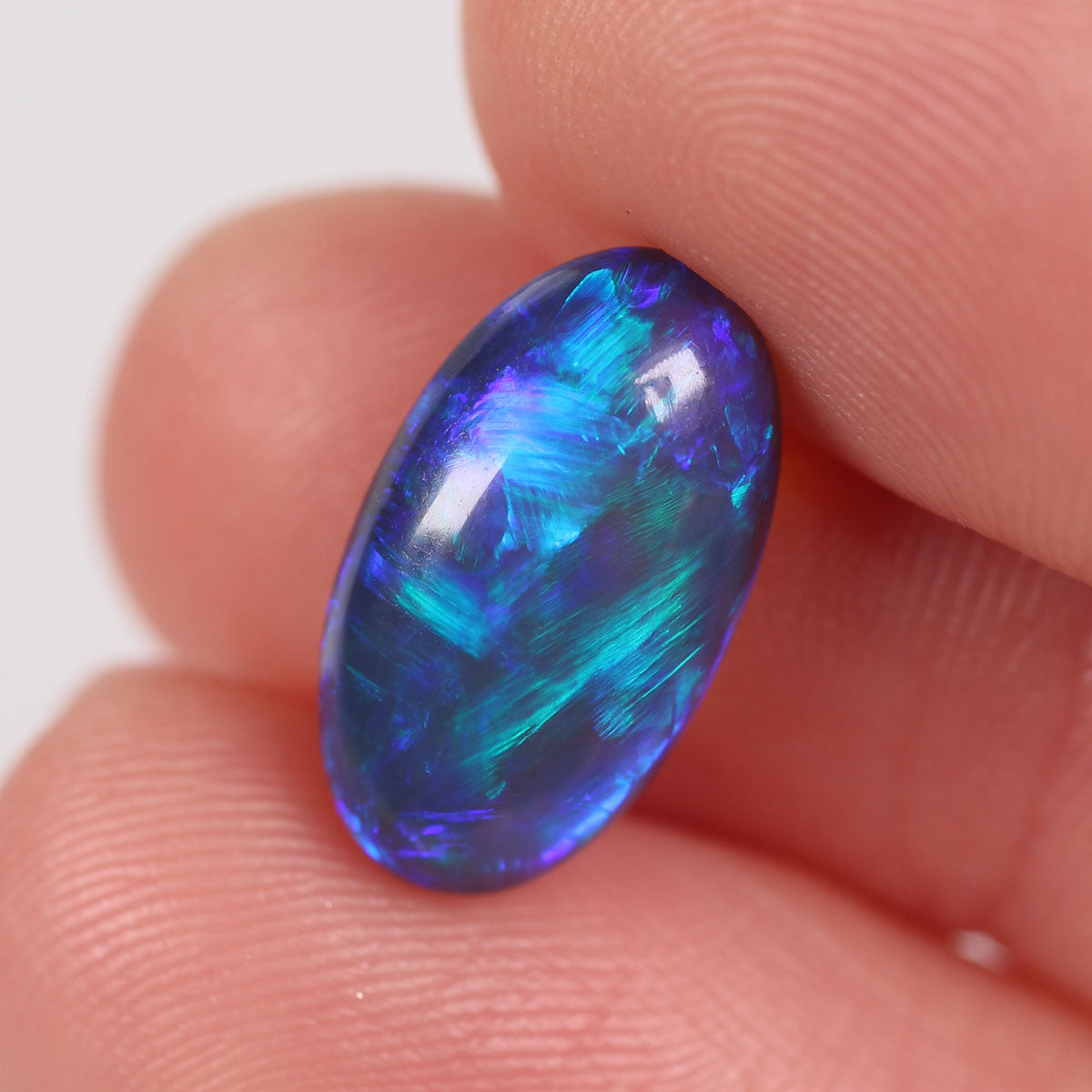 4.57ct Black Opal - 8.7 x 15.5 x 5.9mm