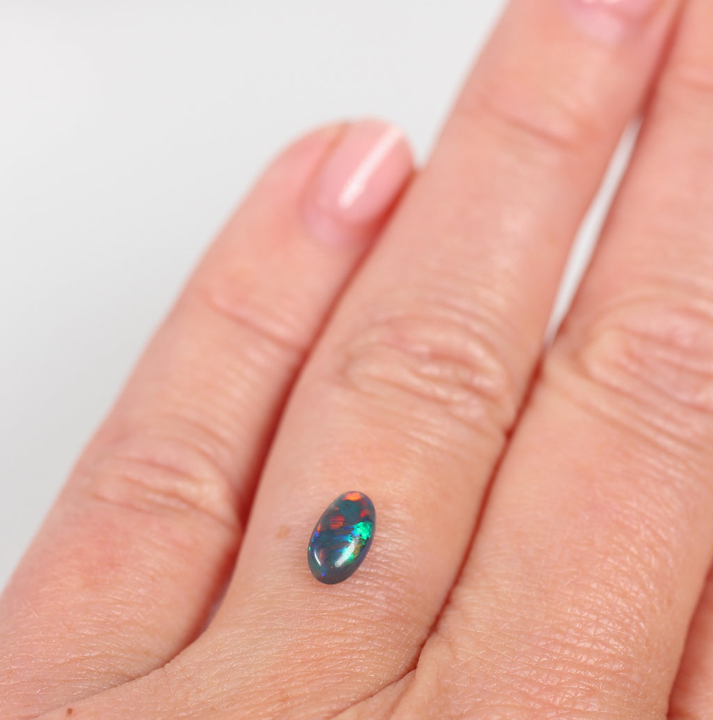 0.48ct Black Opal - 4.3 x 7.5 x 2.5mm