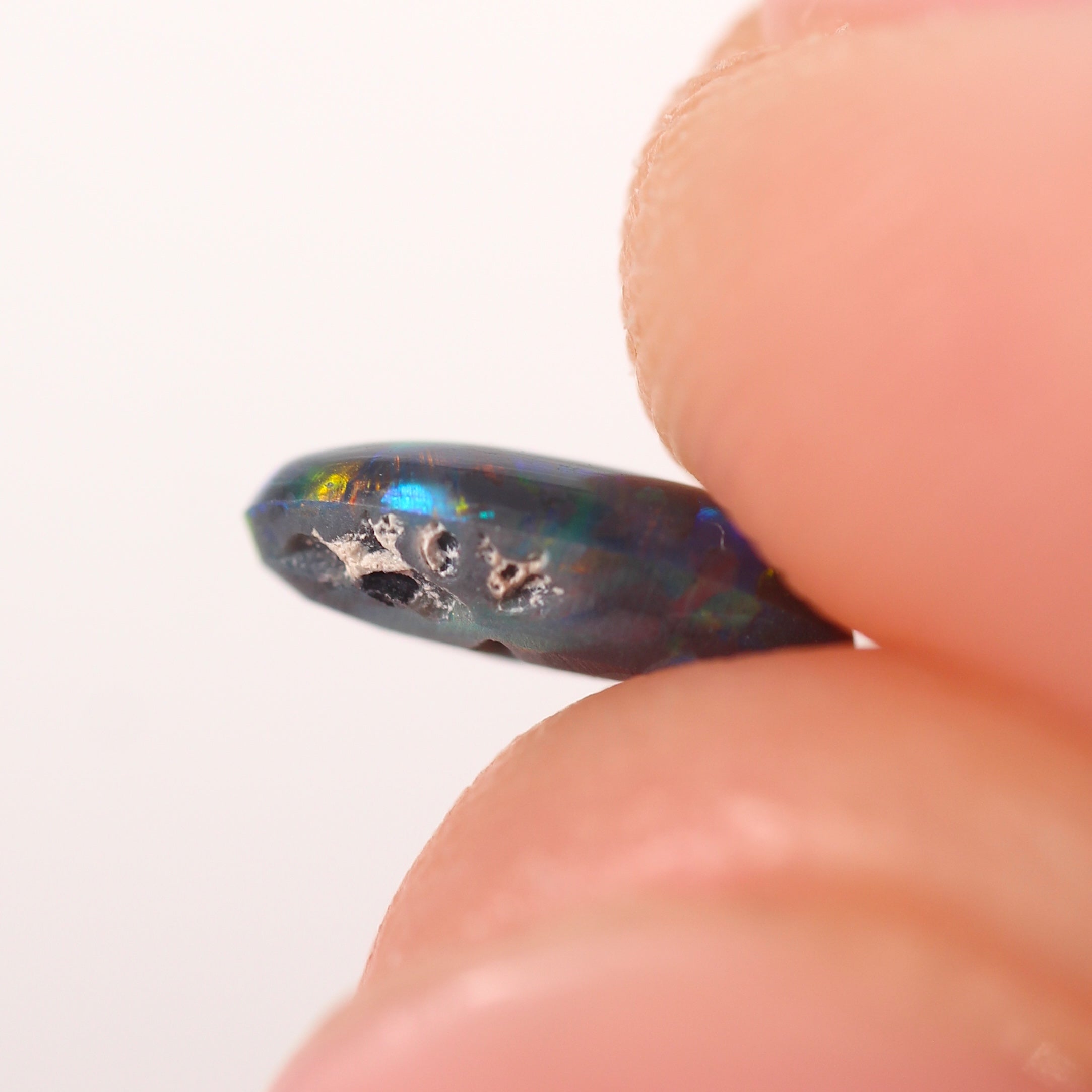 0.48ct Black Opal - 4.3 x 7.5 x 2.5mm