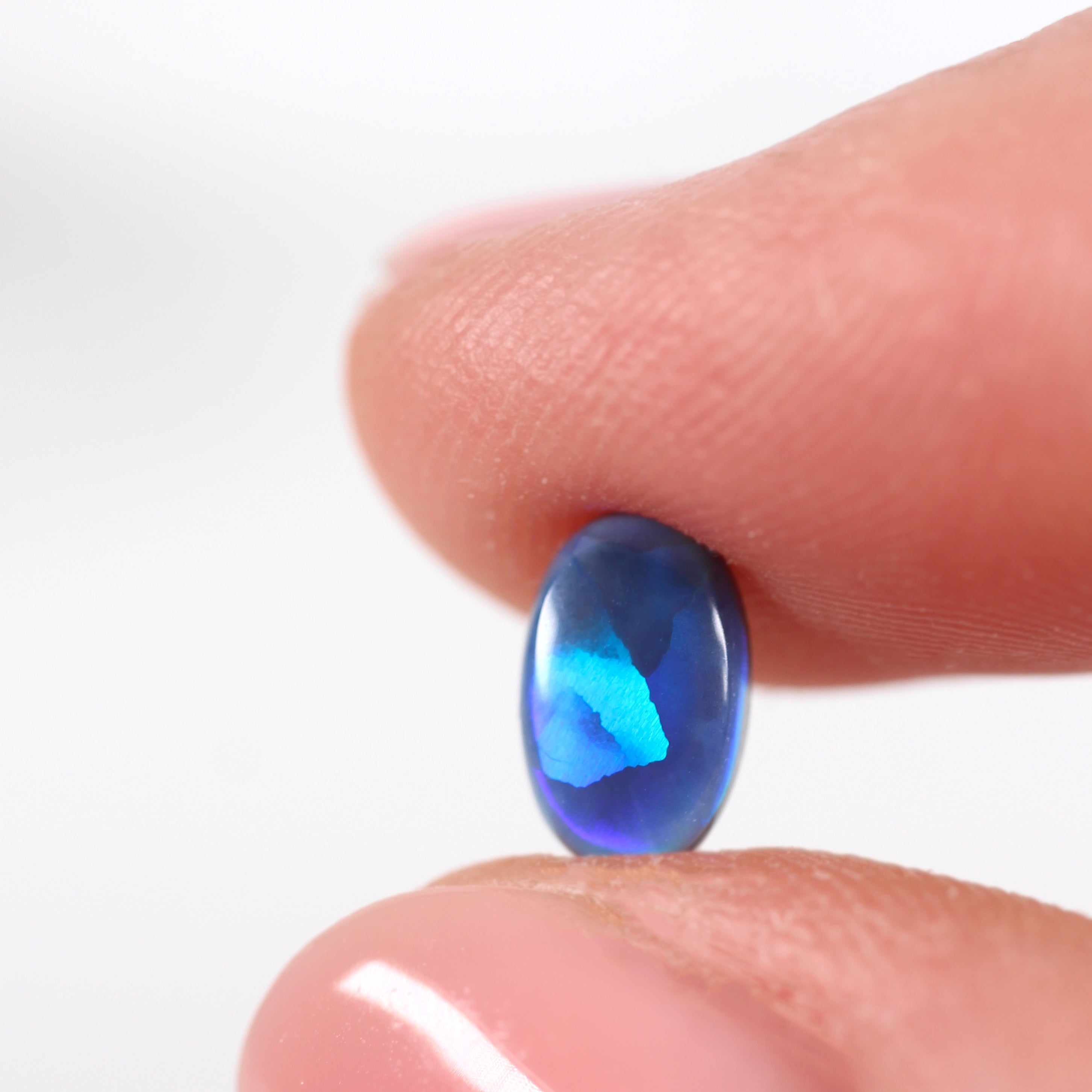 0.85ct Black Opal - 5.4 x 7.8 x 2.8mm