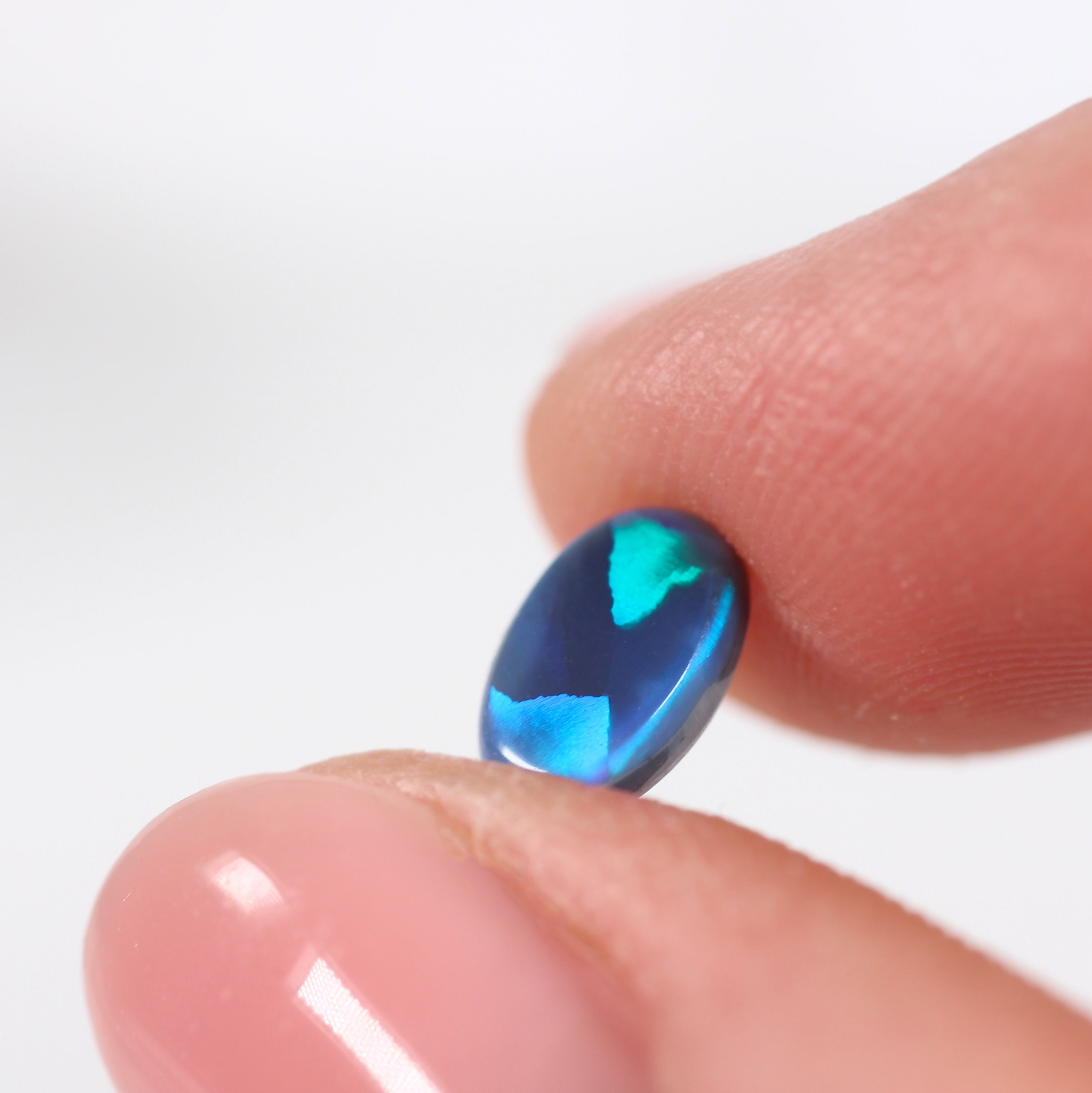 0.85ct Black Opal - 5.4 x 7.8 x 2.8mm