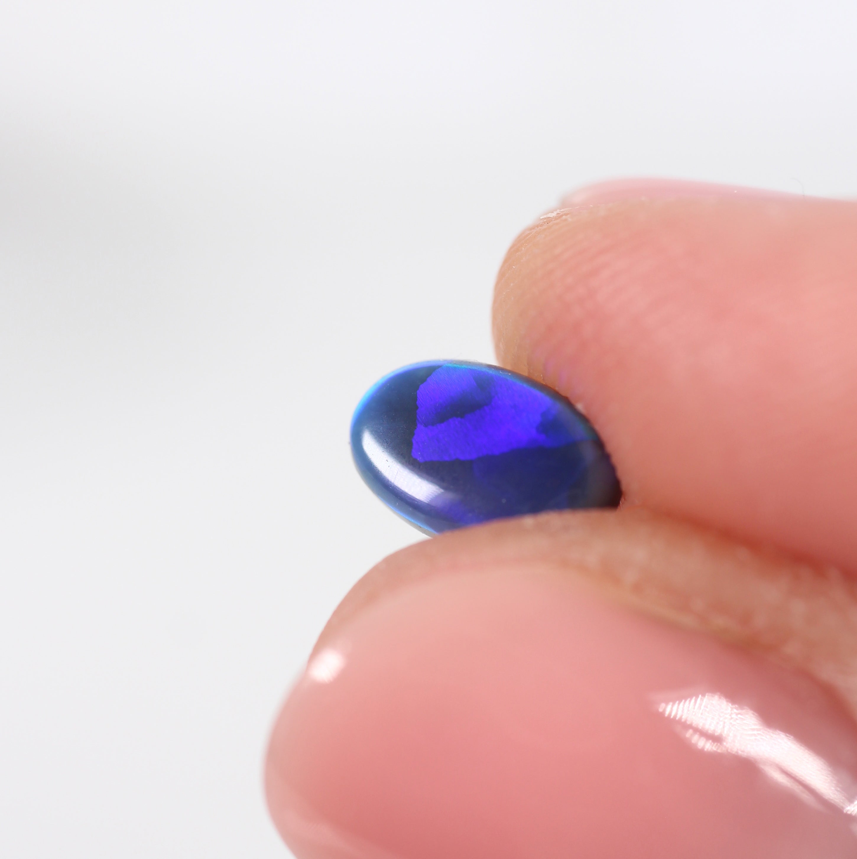 0.85ct Black Opal - 5.4 x 7.8 x 2.8mm