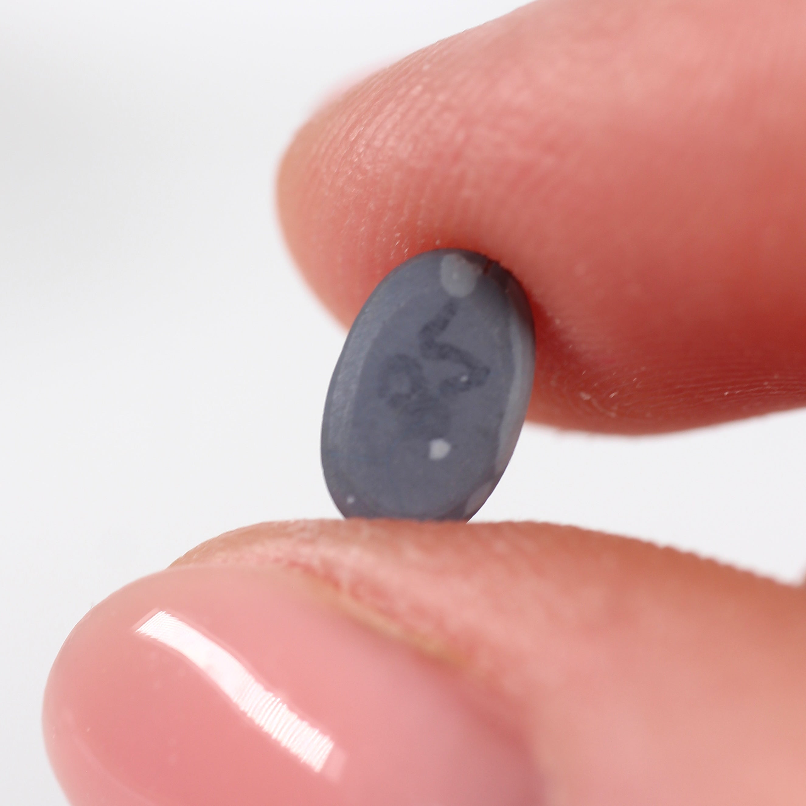 0.85ct Black Opal - 5.4 x 7.8 x 2.8mm