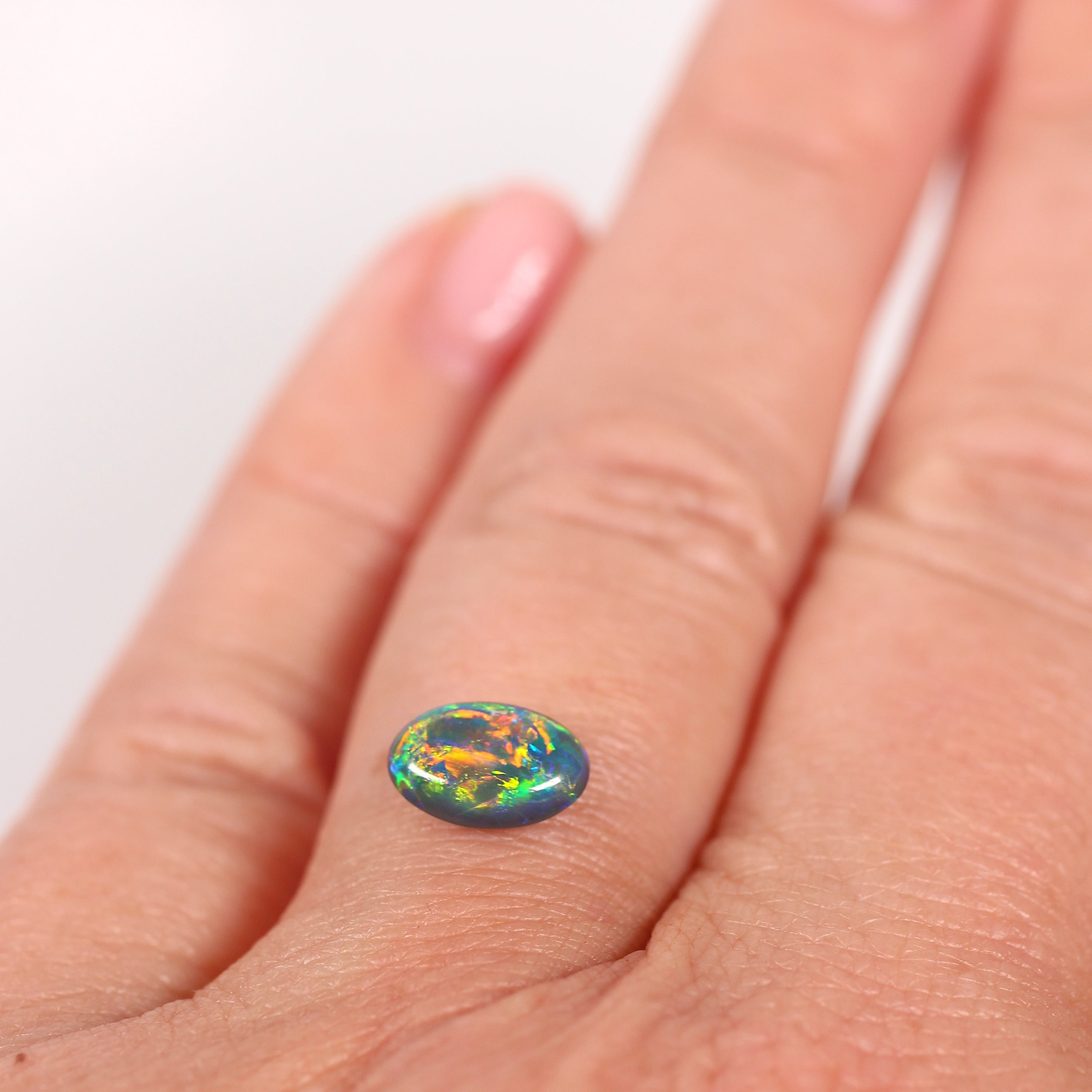 0.91ct Black Opal - 5.4 x 8.3 x 3.5mm