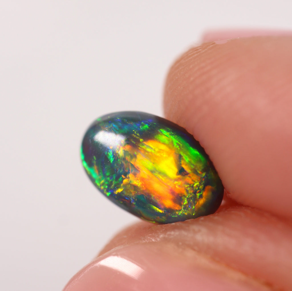 0.91ct Black Opal - 5.4 x 8.3 x 3.5mm