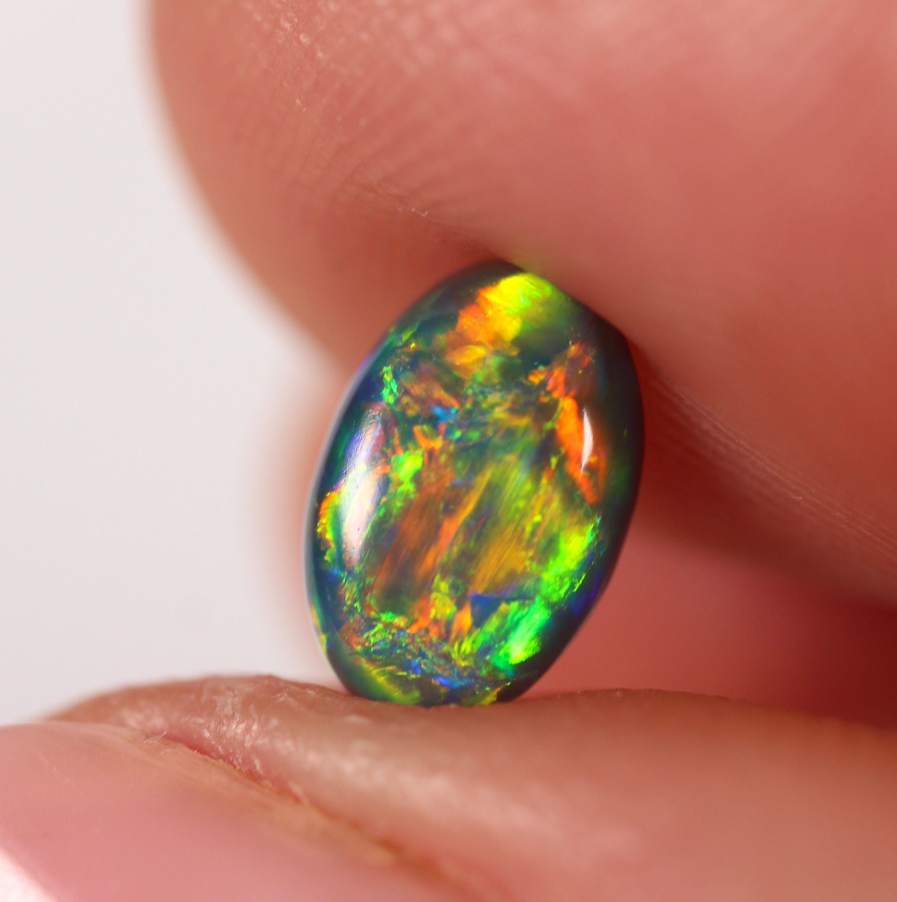 0.91ct Black Opal - 5.4 x 8.3 x 3.5mm