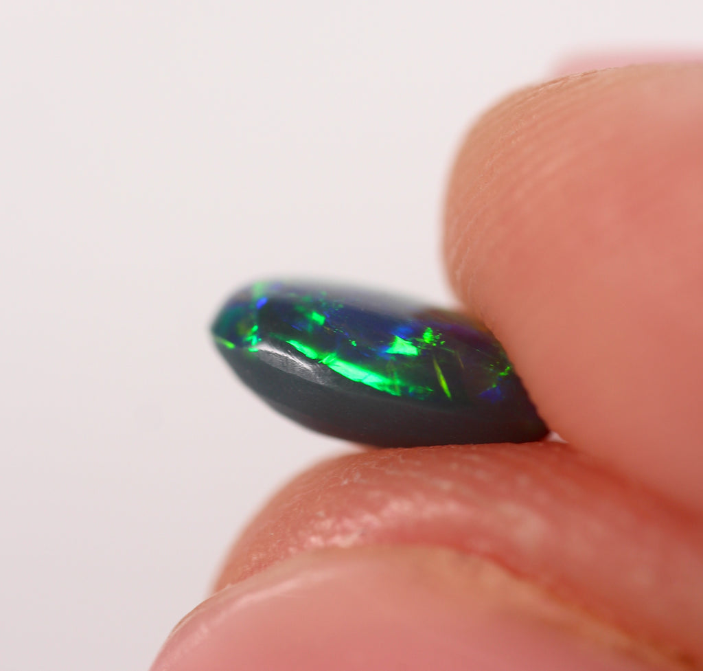 0.91ct Black Opal - 5.4 x 8.3 x 3.5mm