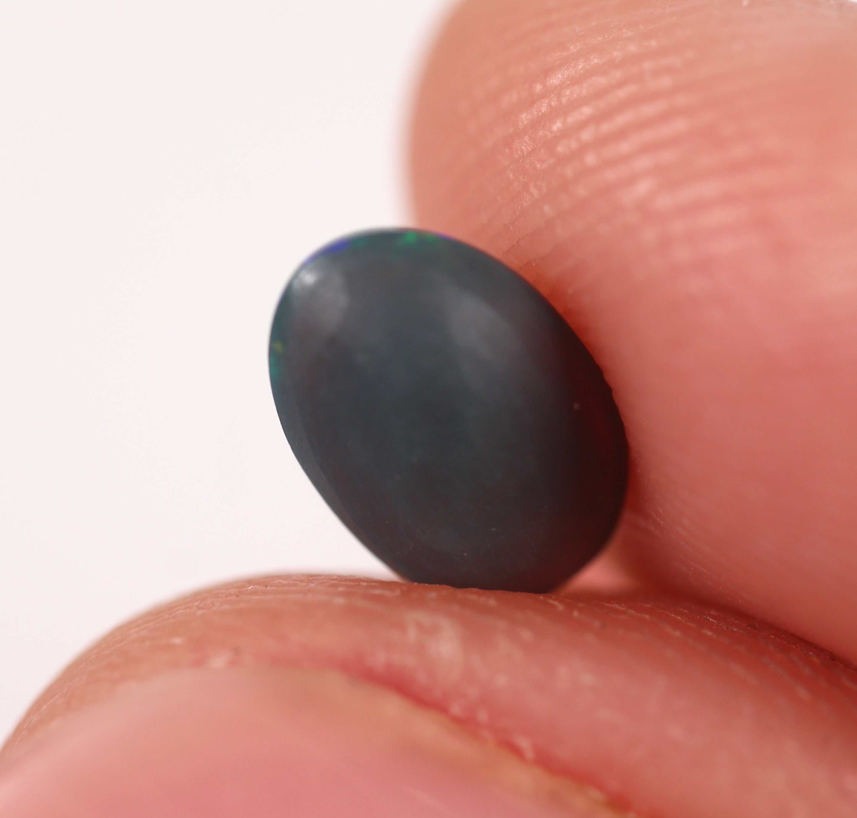 0.91ct Black Opal - 5.4 x 8.3 x 3.5mm