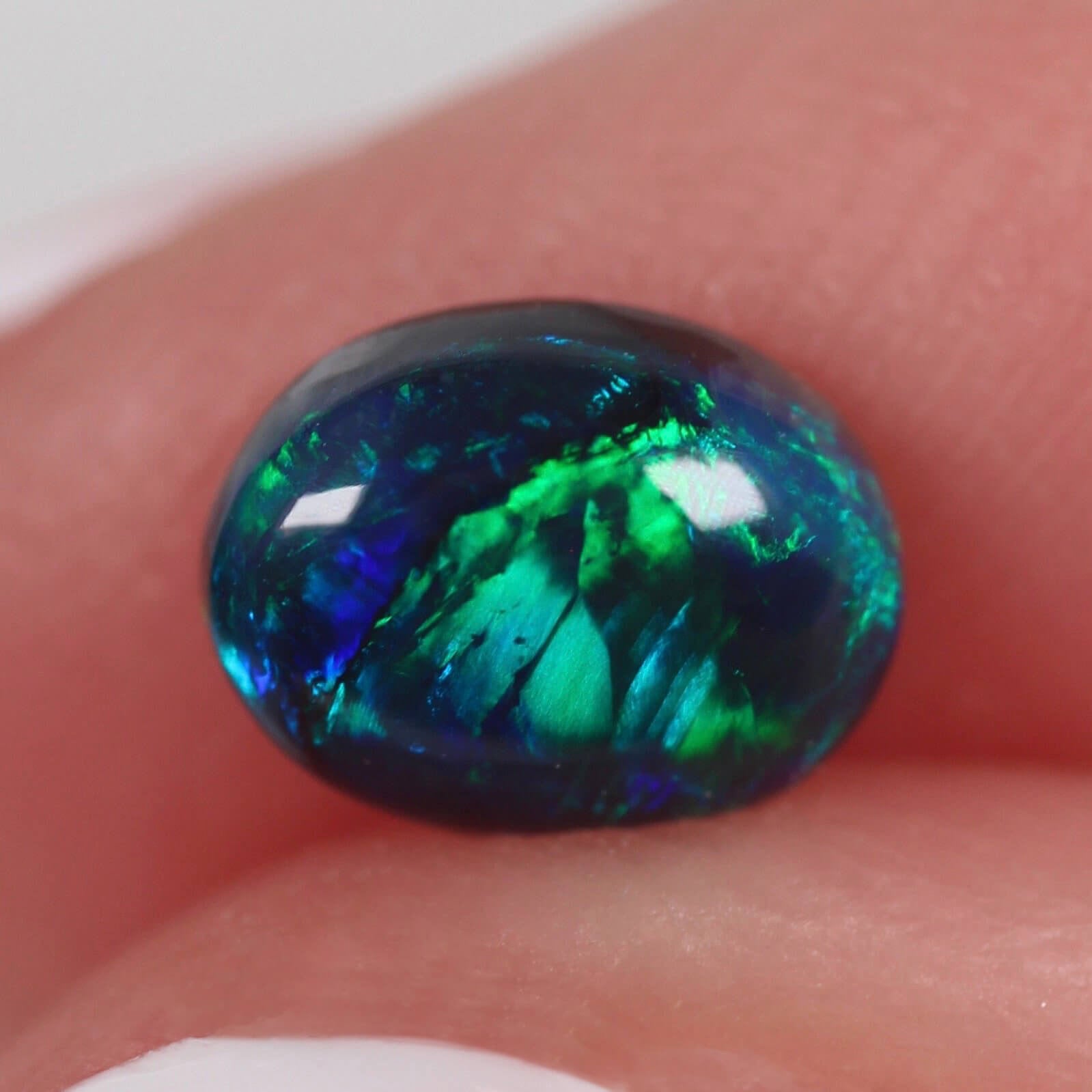 0.71ct Black Opal - 6.8 x 5.2 x 3mm