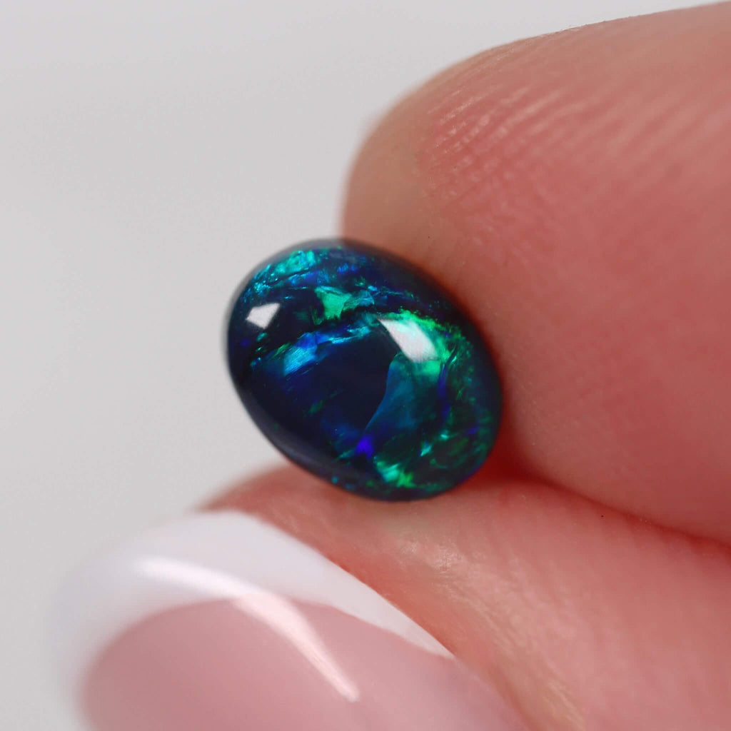 0.71ct Black Opal - 6.8 x 5.2 x 3mm