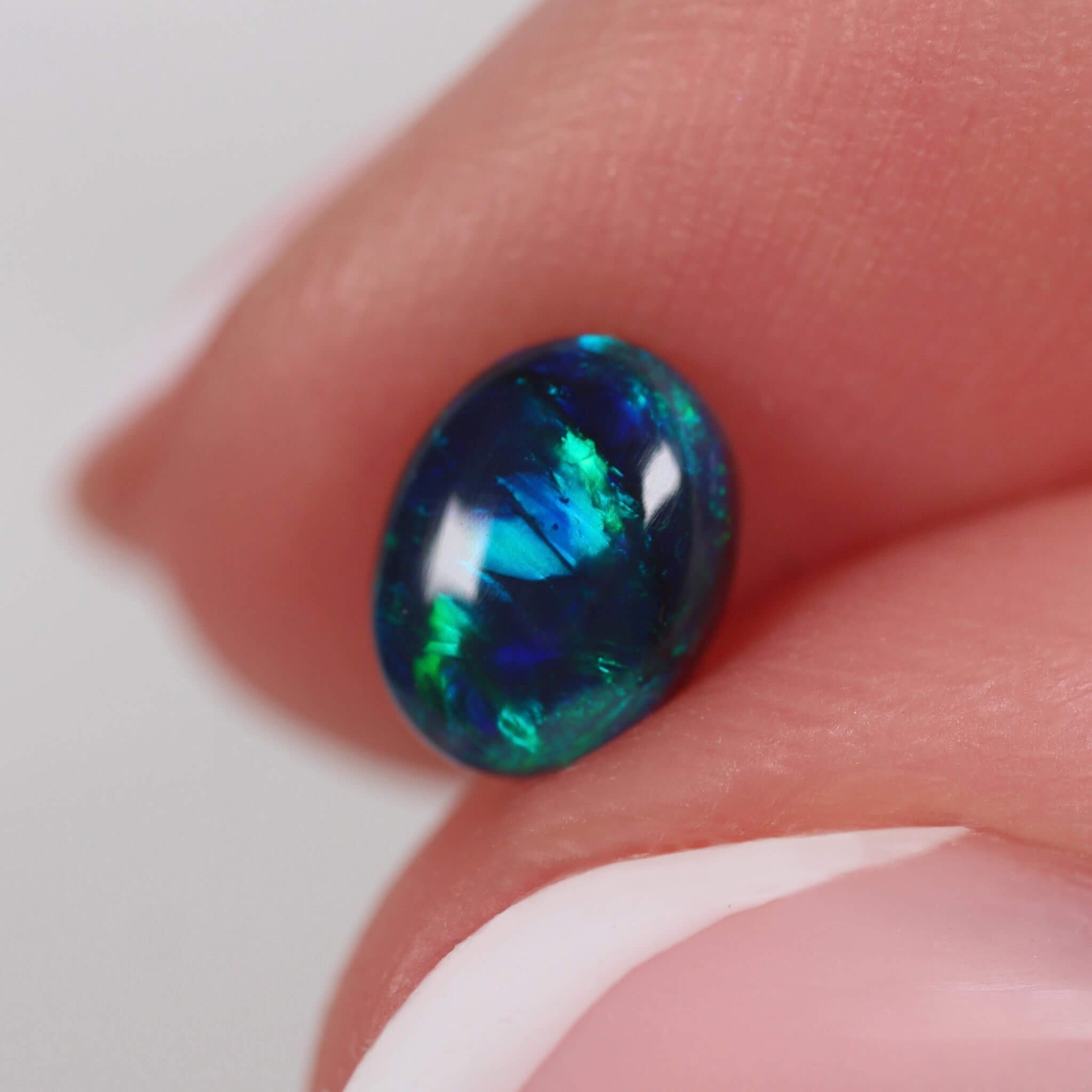 0.71ct Black Opal - 6.8 x 5.2 x 3mm