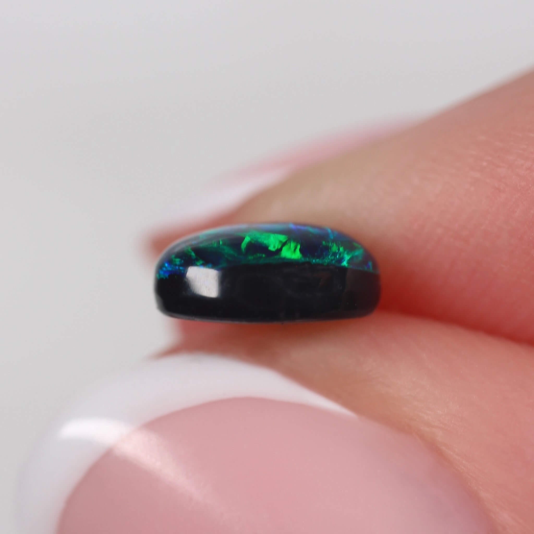 0.71ct Black Opal - 6.8 x 5.2 x 3mm