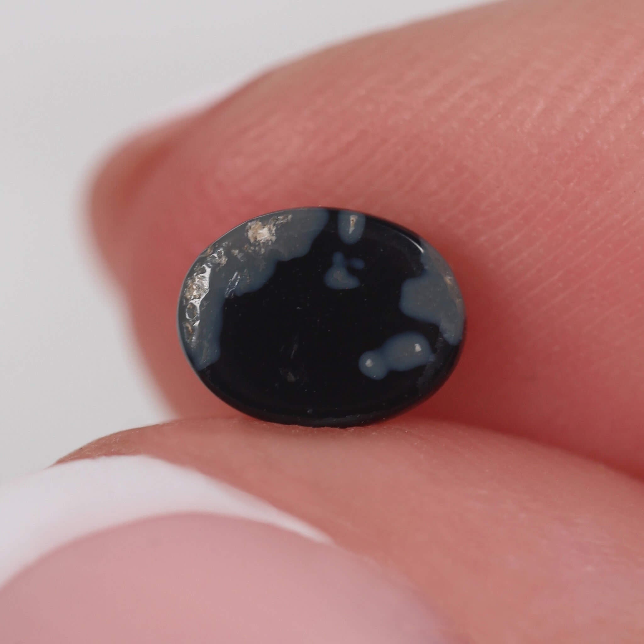 0.71ct Black Opal - 6.8 x 5.2 x 3mm