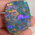 99ct Australian black opal cabochon with red-orange chaff