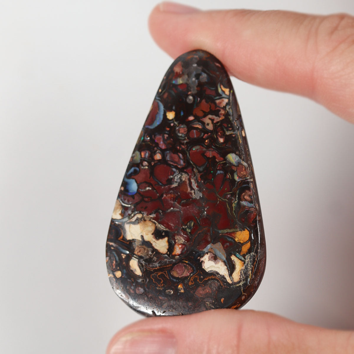 Side view of blue boulder matrix cabochon