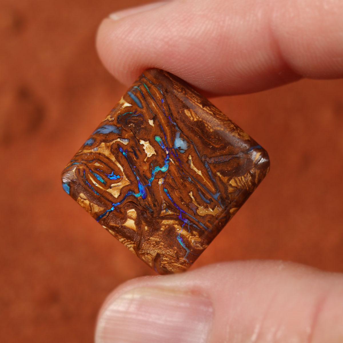 Detail of lively blue flash on boulder matrix