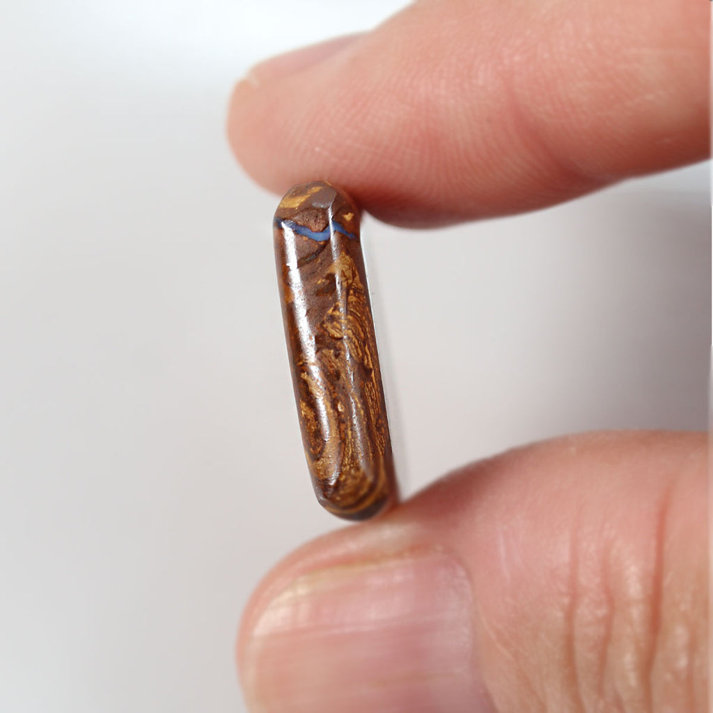 Boulder matrix from Winton held in hand to show scale