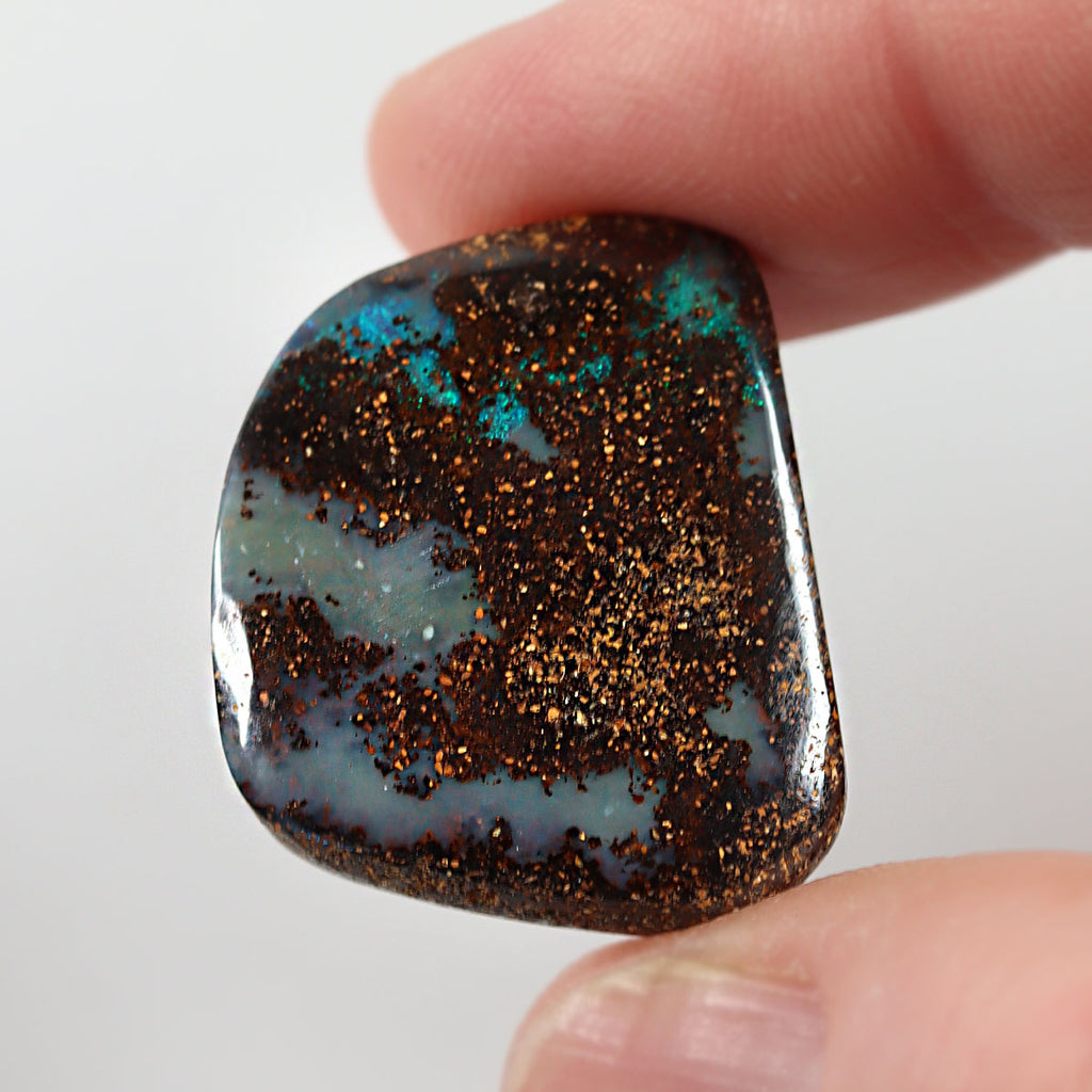 Natural boulder matrix from Koroit, 33.07ct with refined purple flash