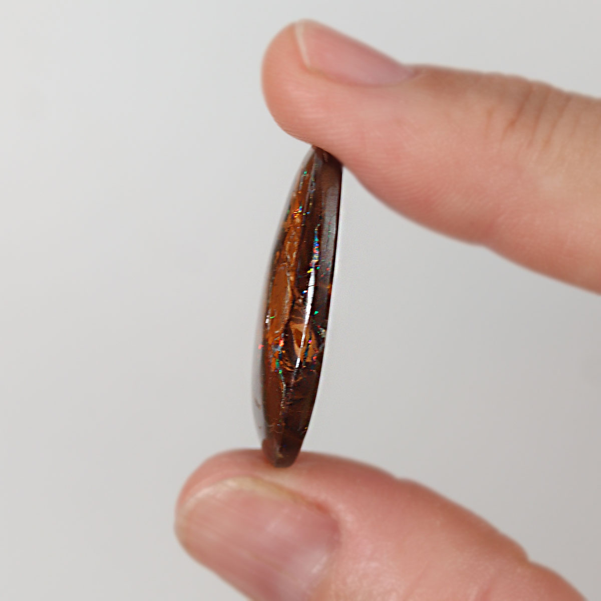 Boulder matrix from Winton held in hand to show scale