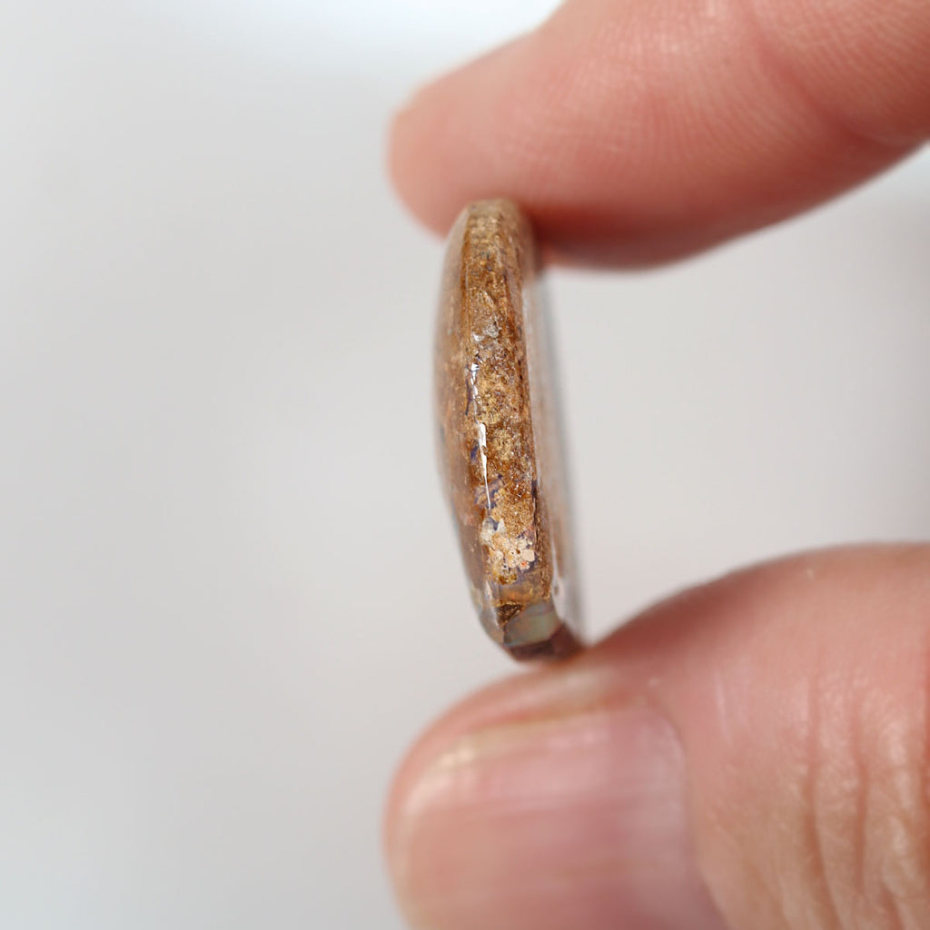 14.81ct boulder matrix held in hand for scale reference