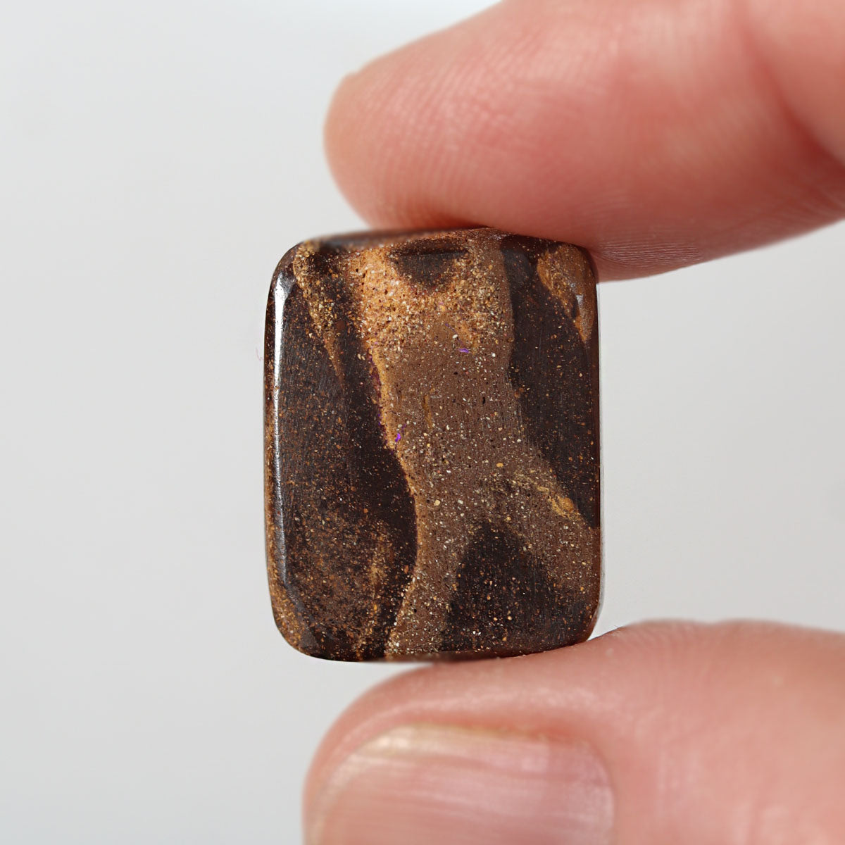 Side view of purple boulder matrix cabochon