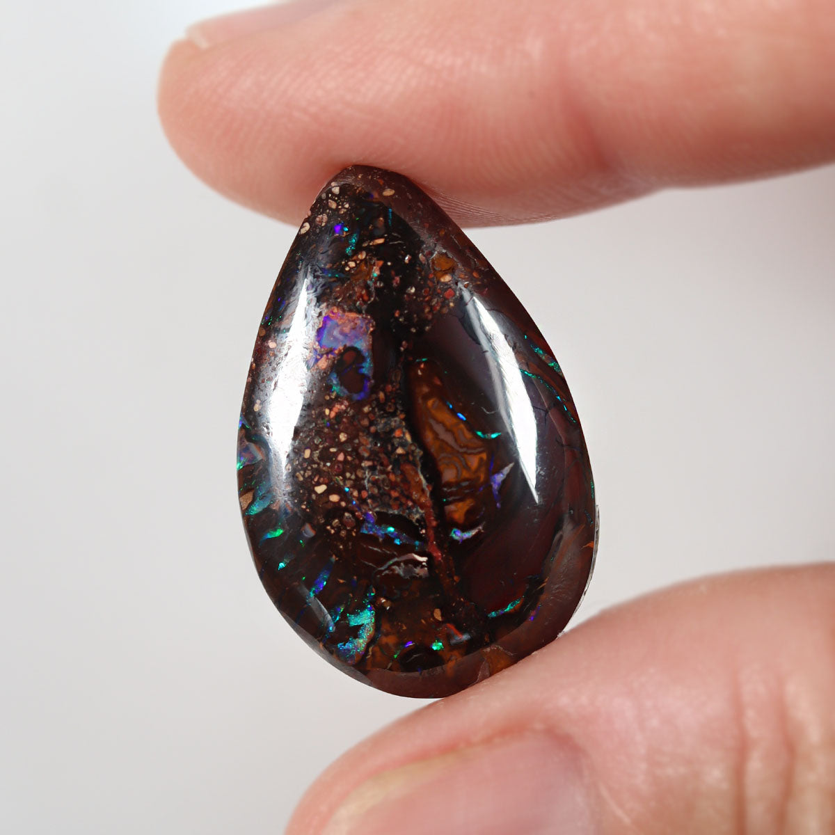 Koroit boulder matrix 15.2ct showing bright purple-blue play-of-colour