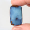 25.83ct soft blue boulder opal cabochon with picture stone pattern