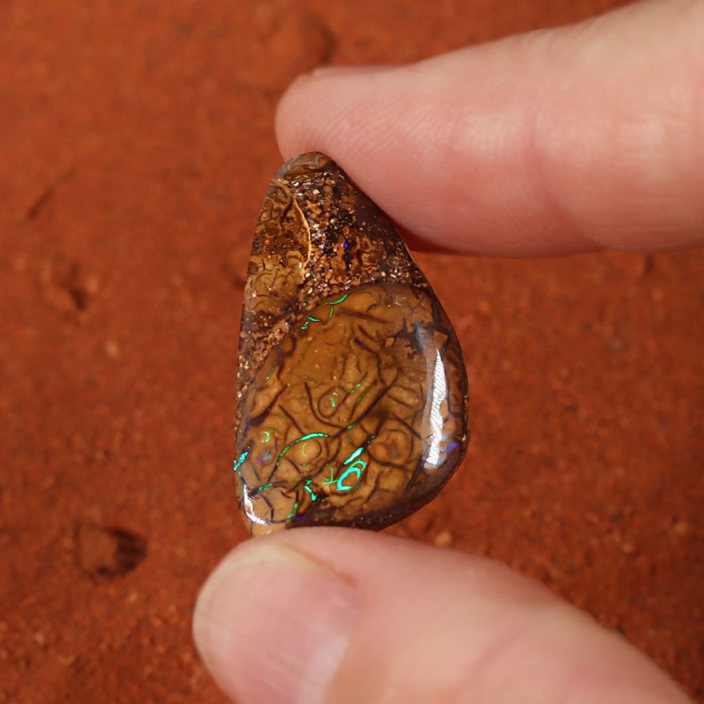Boulder matrix surface detail showing green play-of-colour