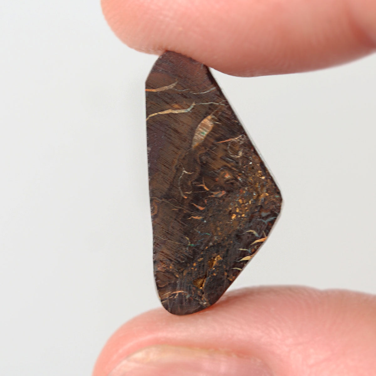 Side view of purple boulder matrix cabochon