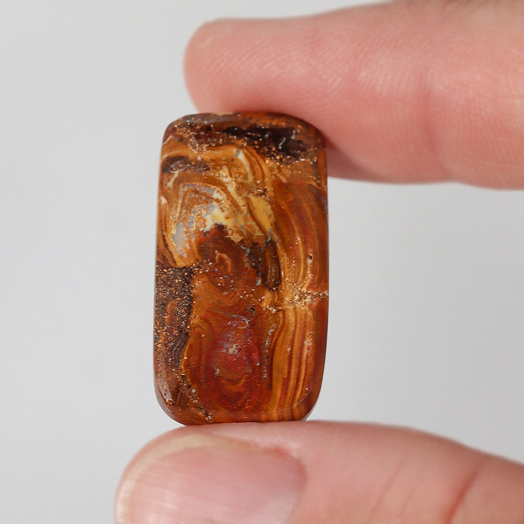 Side view of blue boulder matrix cabochon