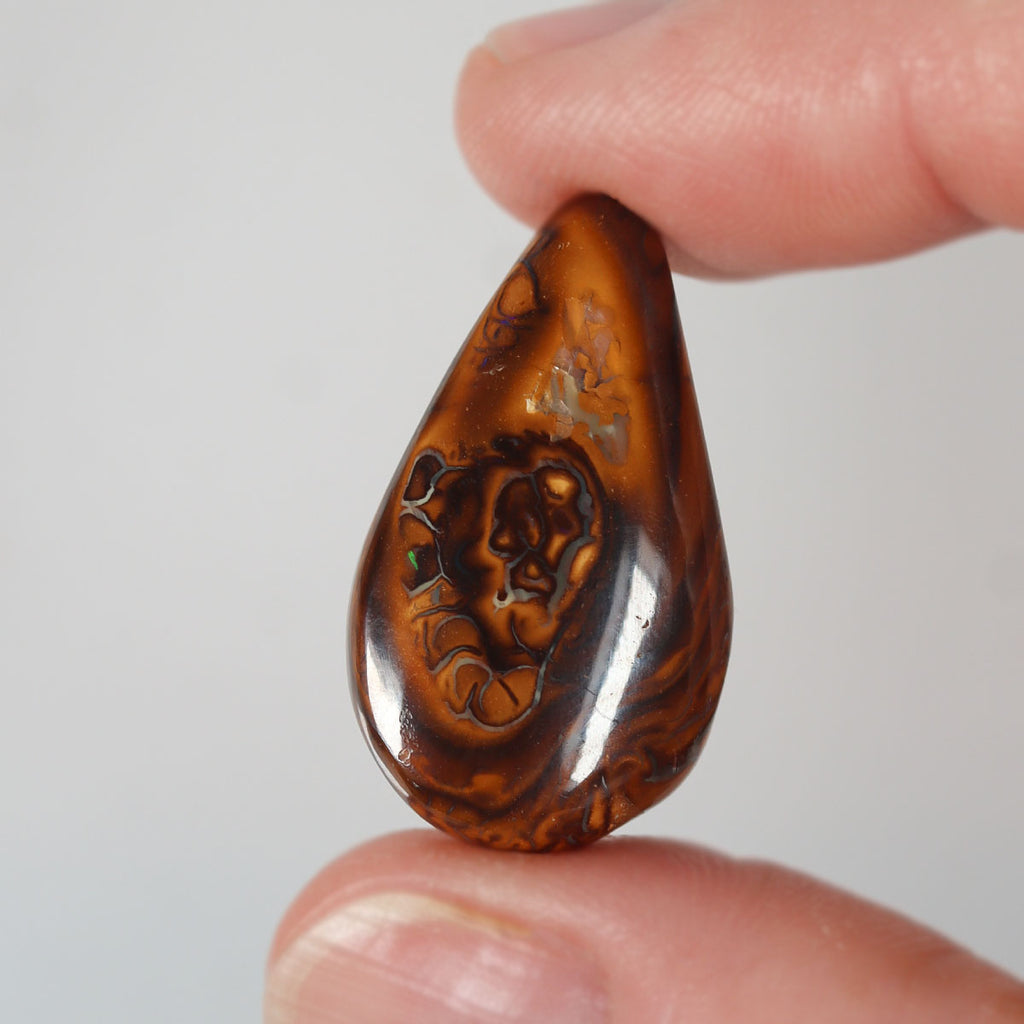 17.32ct boulder matrix cabochon from Koroit with boulder matrix play-of-colour