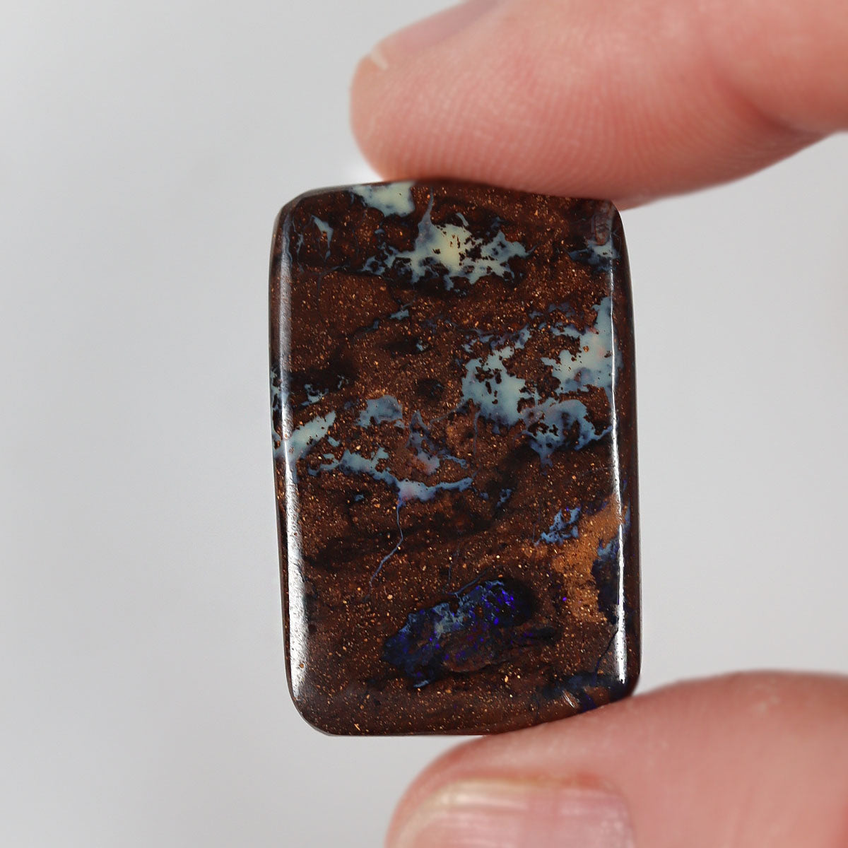 24ct boulder matrix cabochon from Koroit with boulder matrix play-of-colour