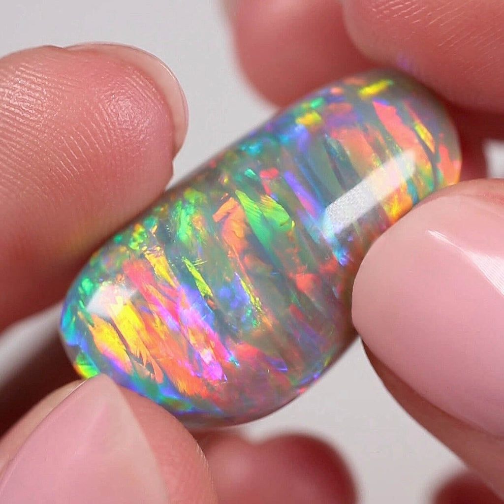 The worlds best Australian Opal. A black opal with a rare striated pattern with every colour in the rainbow