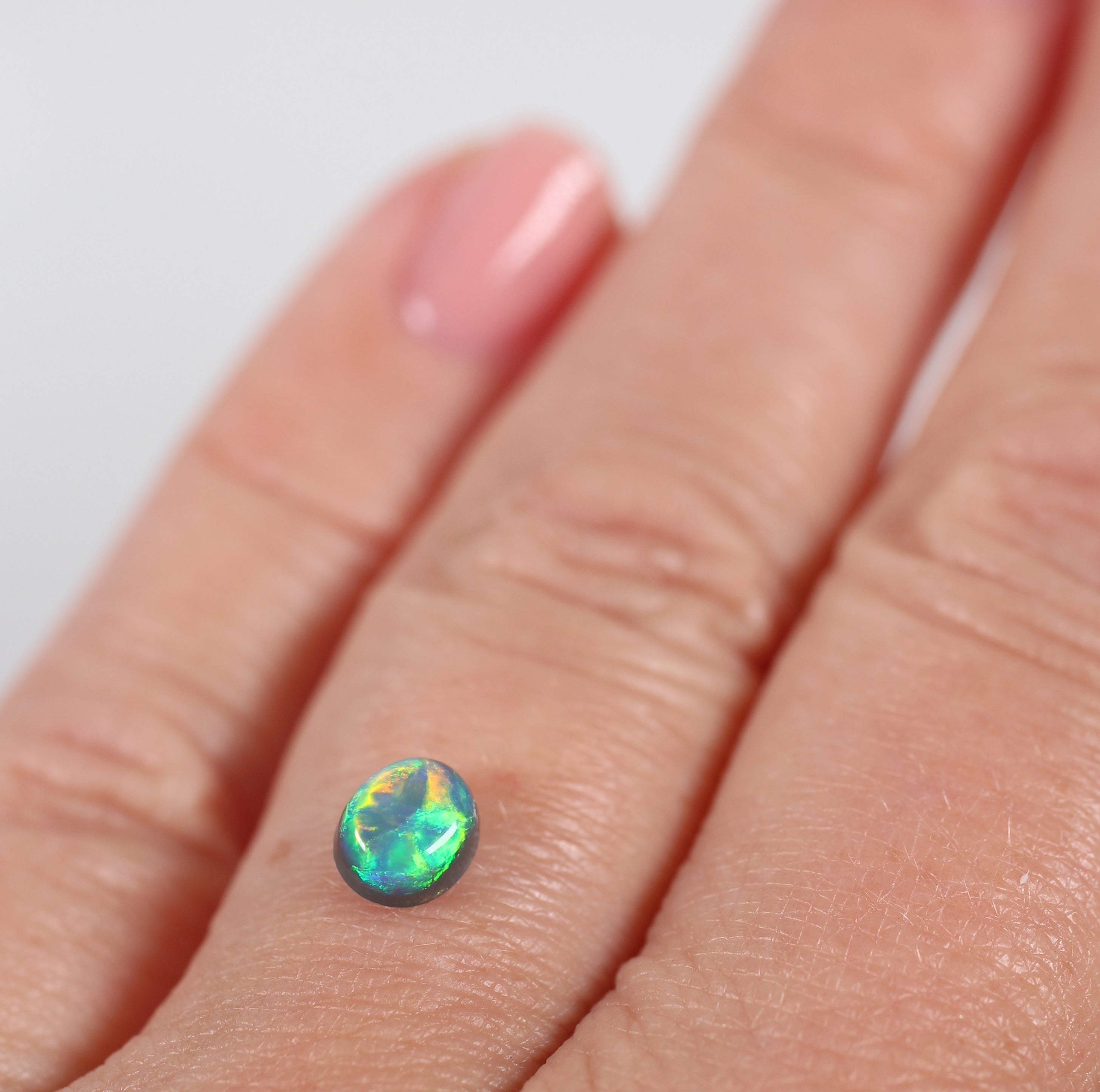 0.66ct Black Opal - 5 x 5.5 x 3.8mm