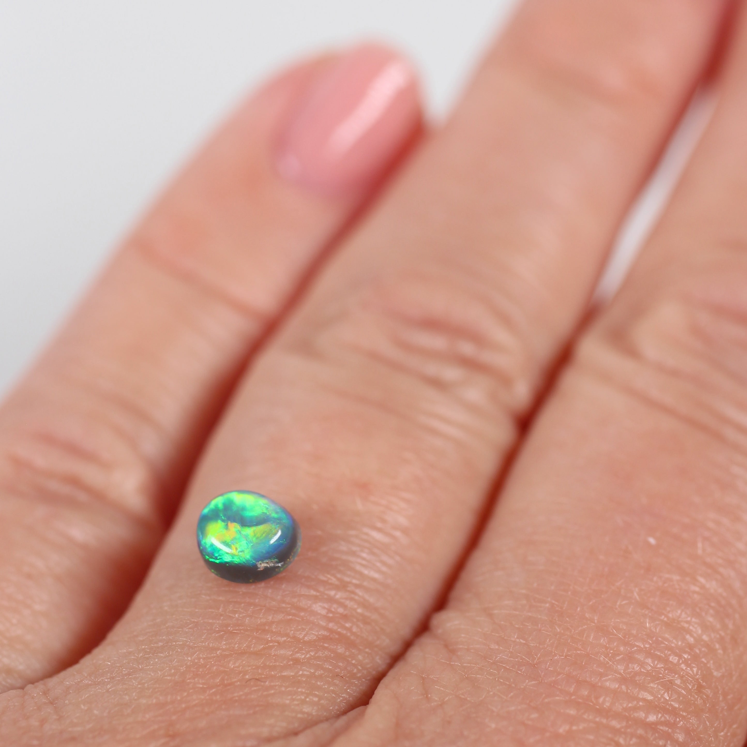 0.66ct Black Opal - 5 x 5.5 x 3.8mm