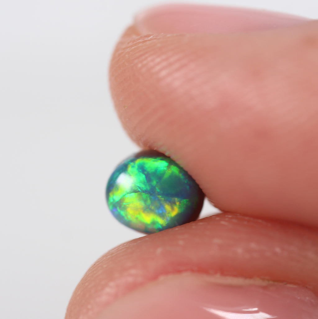 0.66ct Black Opal - 5 x 5.5 x 3.8mm
