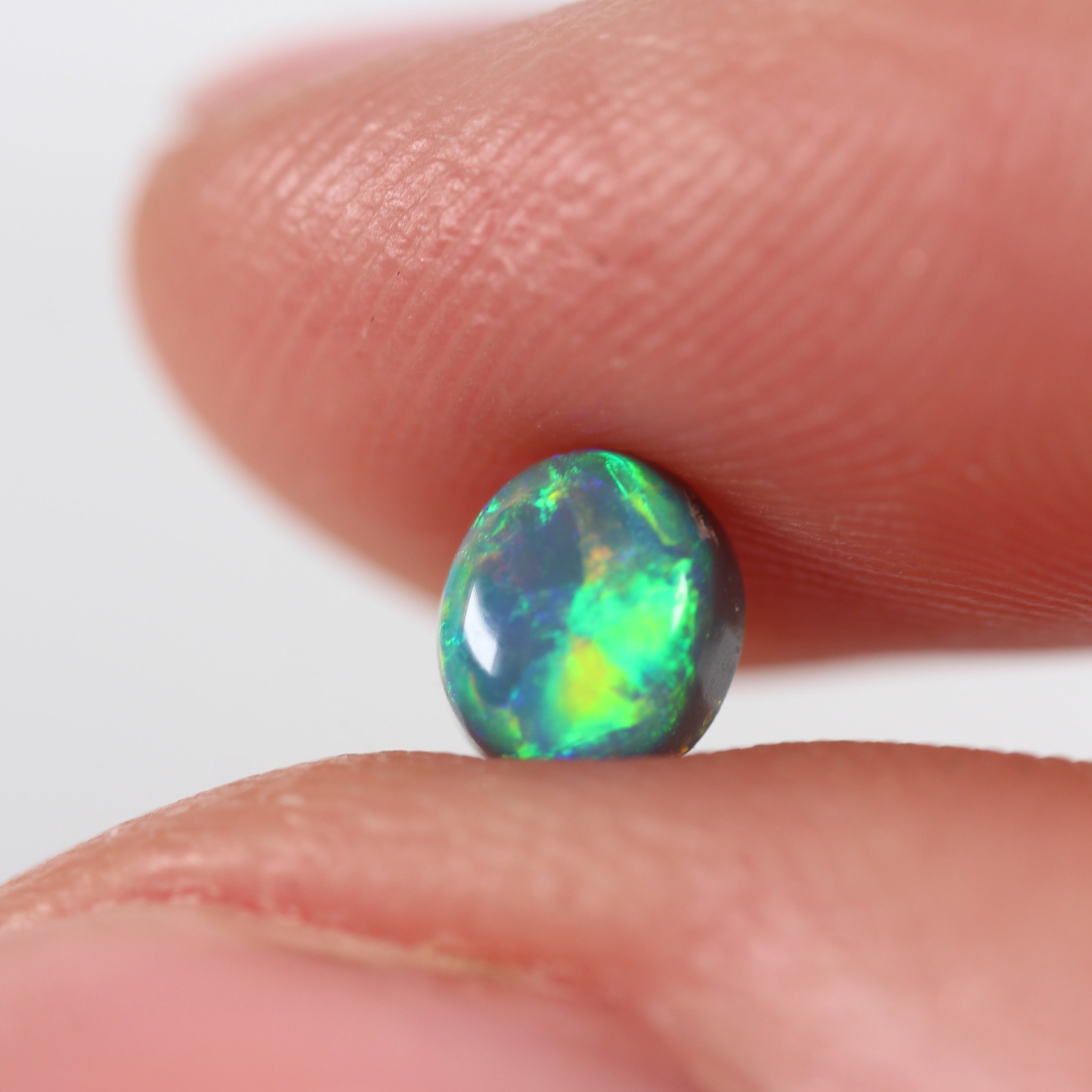 0.66ct Black Opal - 5 x 5.5 x 3.8mm