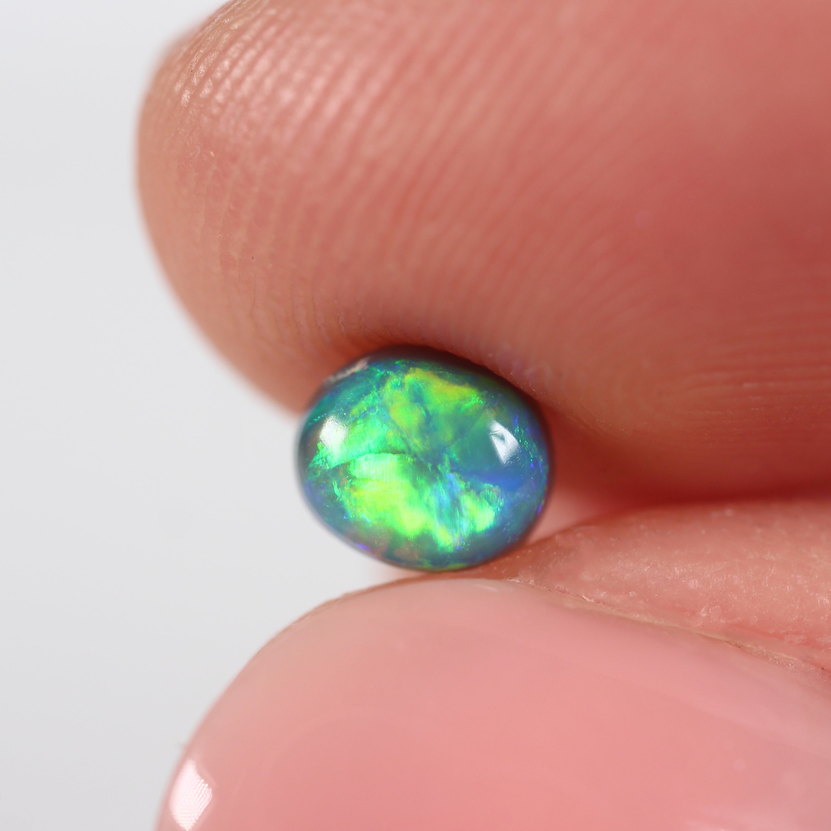 0.66ct Black Opal - 5 x 5.5 x 3.8mm