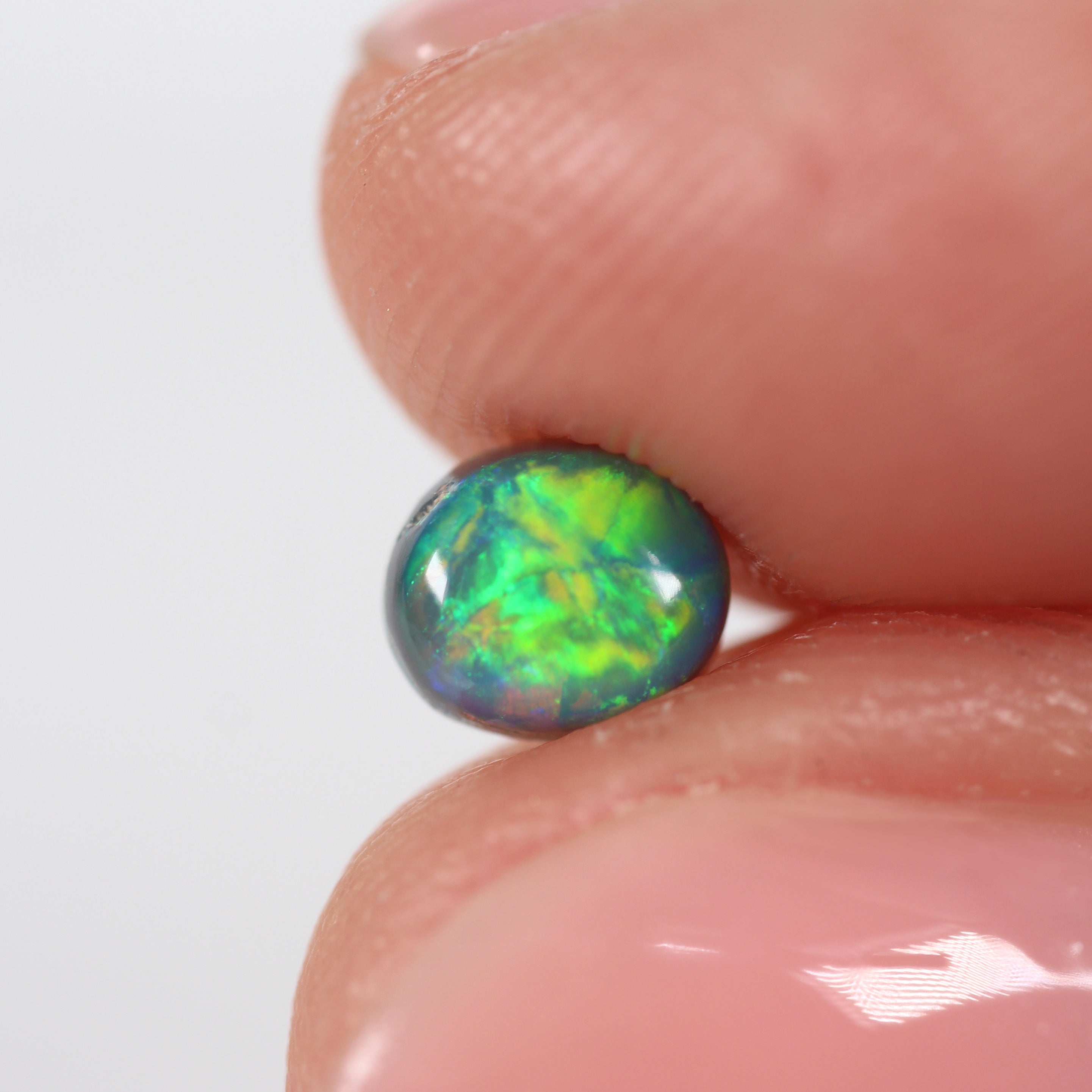0.66ct Black Opal - 5 x 5.5 x 3.8mm