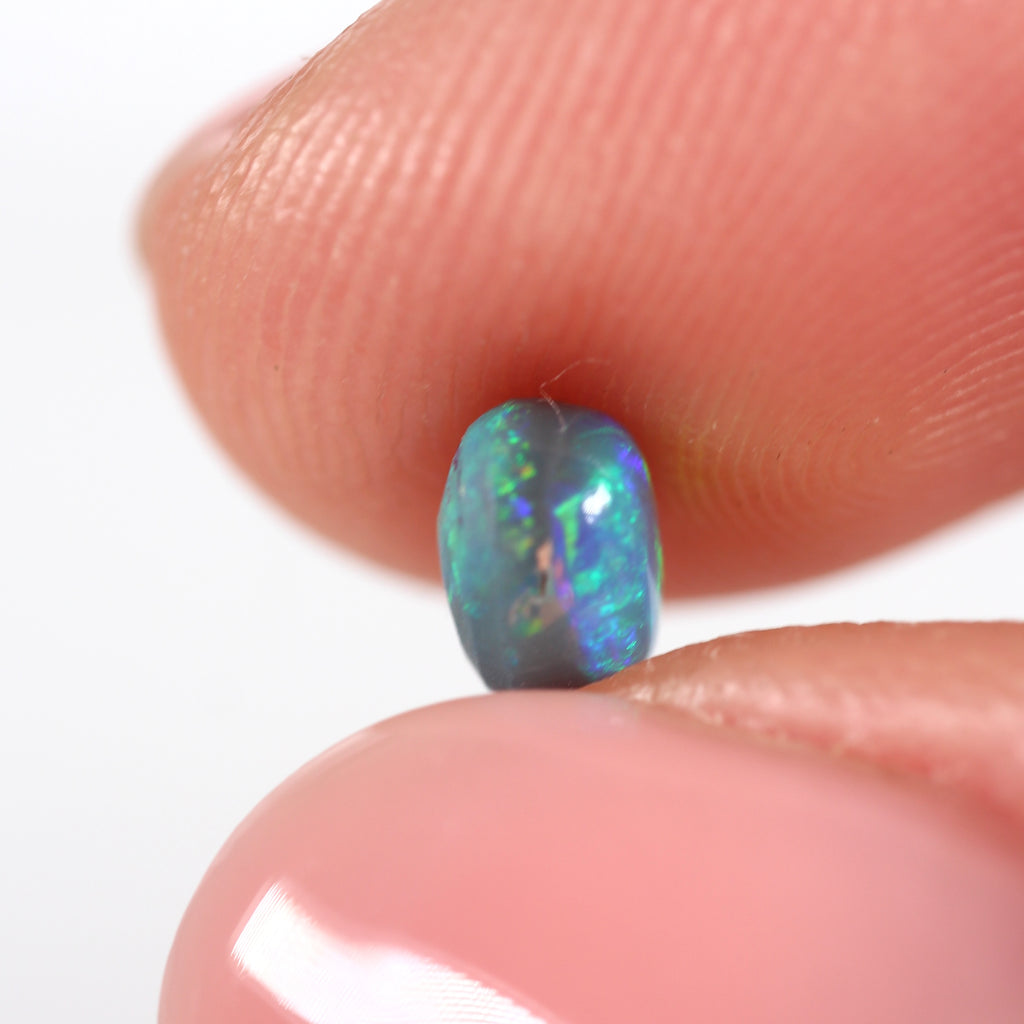 0.66ct Black Opal - 5 x 5.5 x 3.8mm
