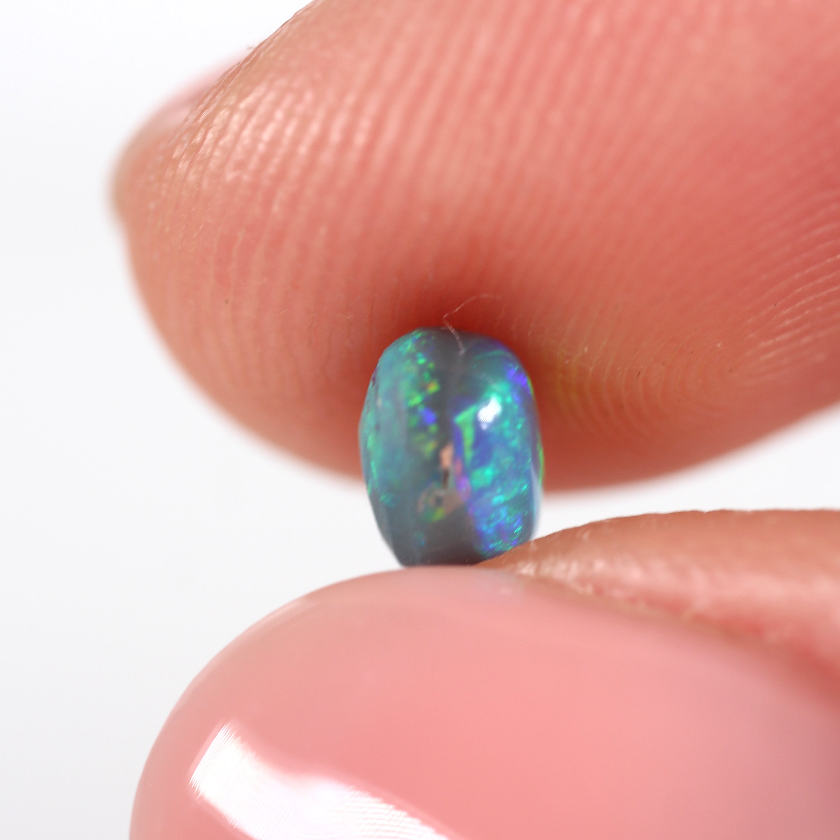 0.66ct Black Opal - 5 x 5.5 x 3.8mm
