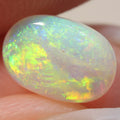 0.86ct crystal opal shown under rolling light