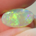 2.28ct Australian dark crystal opal shown for size comparison
