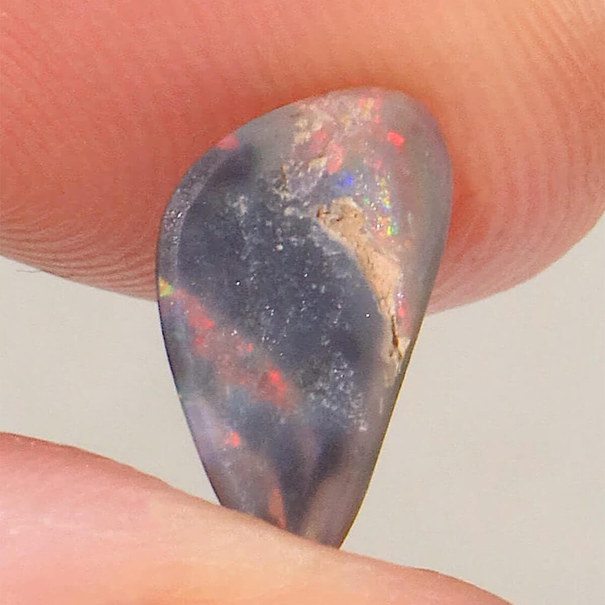 0.74ct Black Opal - 6.5 x 11 x 2mm