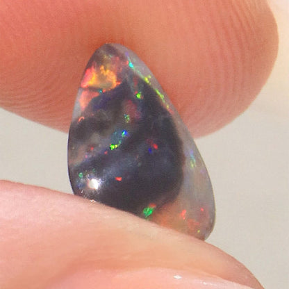 0.74ct Black Opal - 6.5 x 11 x 2mm