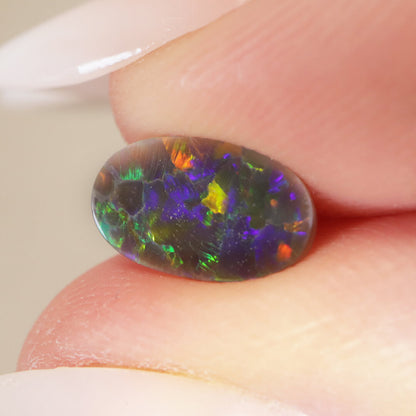 0.65ct Black Opal - 5.5 x 9.5 x 1.7mm