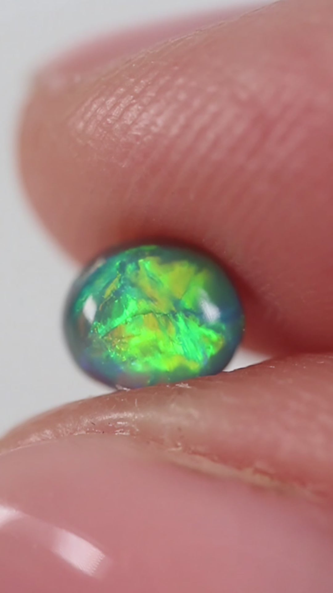 0.66ct Black Opal - 5 x 5.5 x 3.8mm